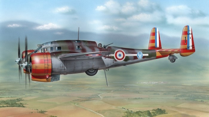 French military aircraft flying over a landscape