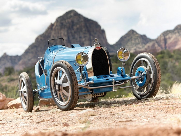 Blue 1926 Bugatti vintage race car in desert landscape