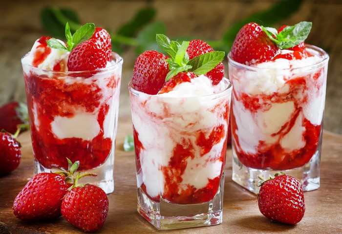 Strawberry and cream dessert with mint leaves