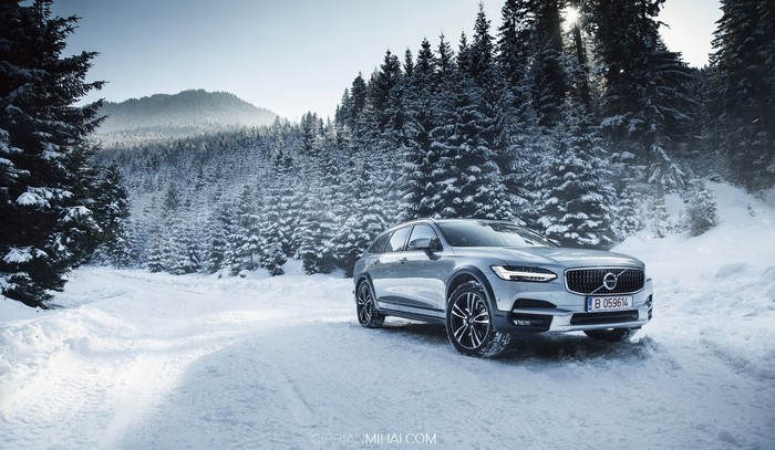 Volvo V90 CC in a snowy forest