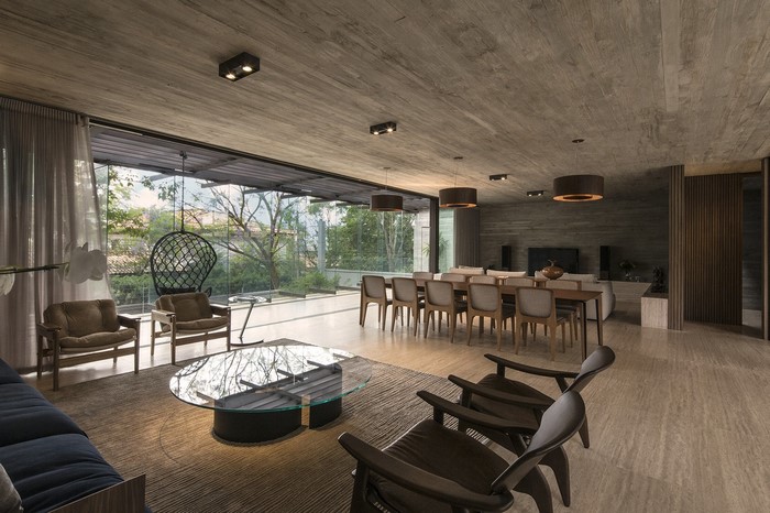 Modern living and dining room with large windows
