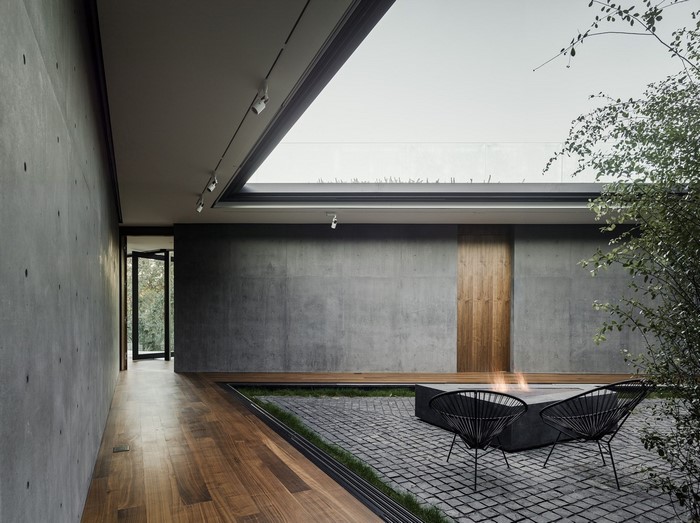 Modern house interior with courtyard and fire pit
