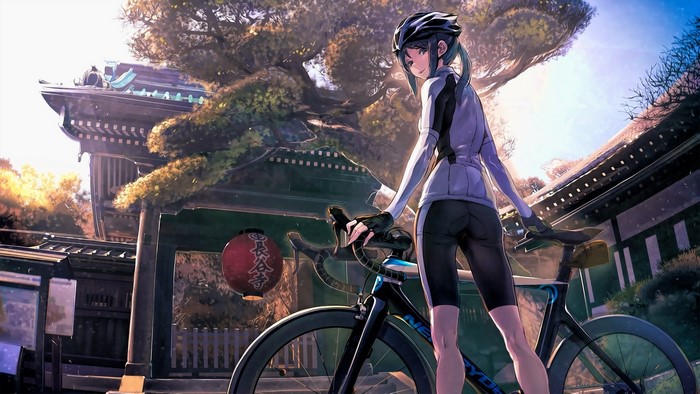 Girl in cycling gear with bicycle at a temple