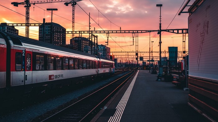 Train at a station during sunset in Switzerland
