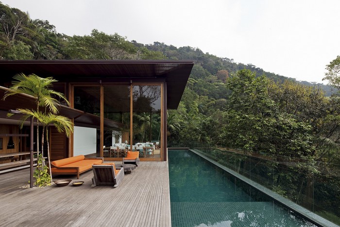 Modern house with swimming pool and jungle view
