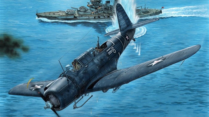 WWII aircraft attacking a battleship