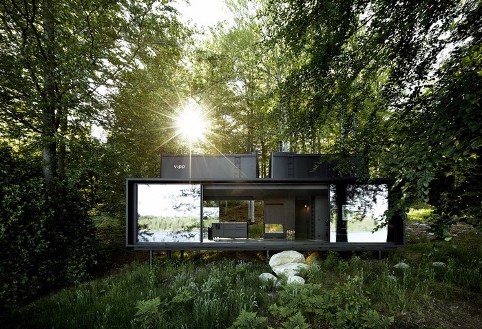 Modern Vipp house in a forest by a lake