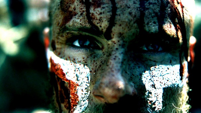 Close-up of a warrior with face paint