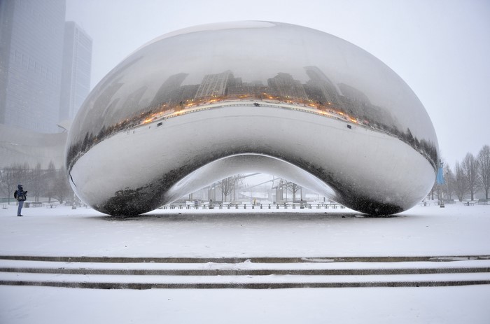 Cloud Gate sculpture in Chicago during winter snowfall