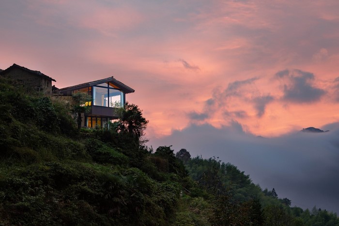 Modern house on a hill at sunset