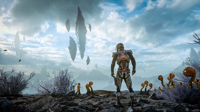 Male astronaut on an alien planet with floating rocks