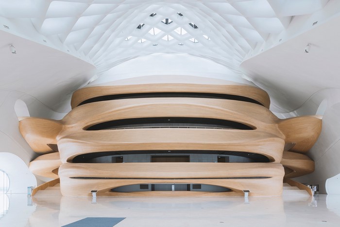 Modern architecture interior with wooden curved walls and ceiling