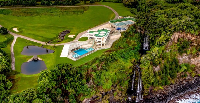 Cliffside mansion with golf course and waterfalls
