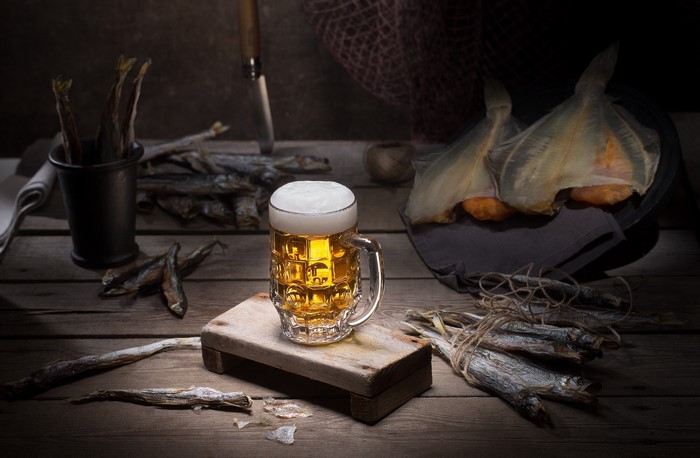 Still life with beer and dried fish