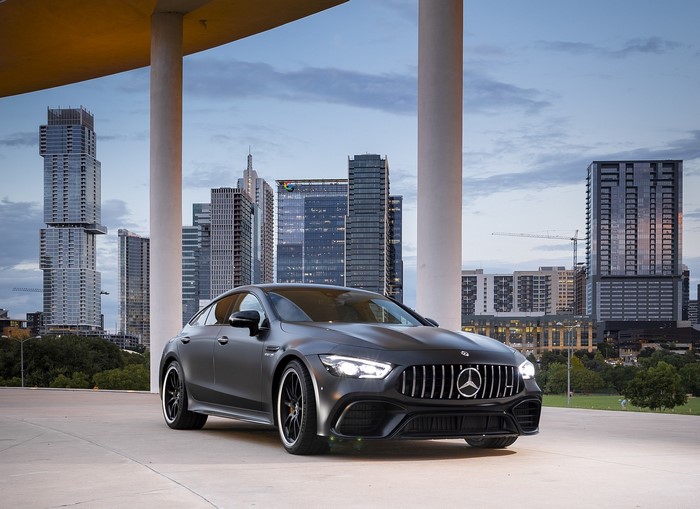 Matte black Mercedes-AMG GT 4-door coupe in a city