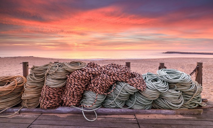 Ropes on a beach at sunset