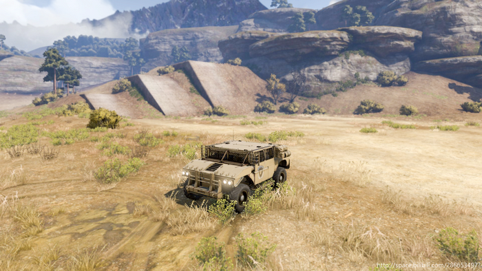 Military vehicle in a dry, hilly landscape