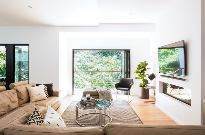 Modern living room with large windows and fireplace