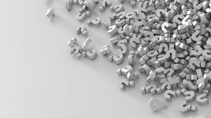Pile of 3D question marks on a white background