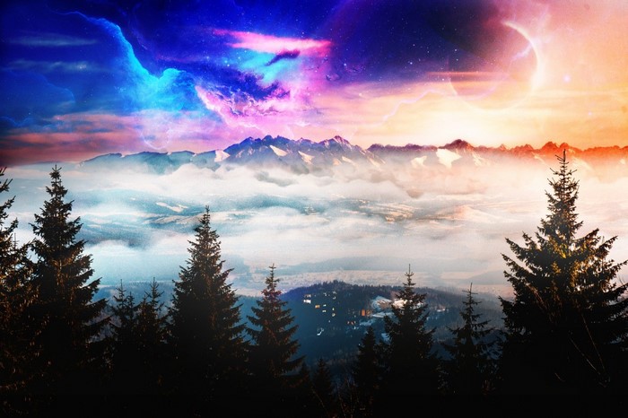 Mountains and trees under a colorful nebula sky