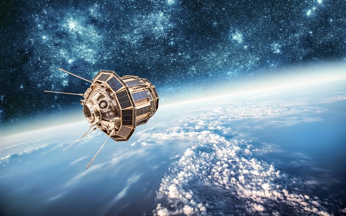 Satellite orbiting Earth with stars in the background