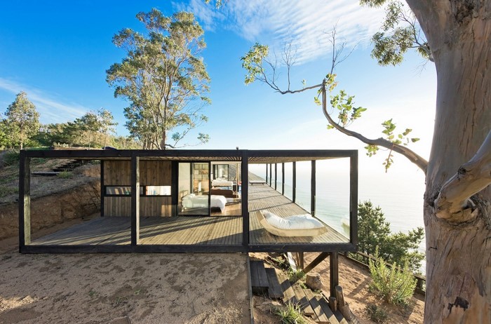 Modern house on a cliff overlooking the ocean