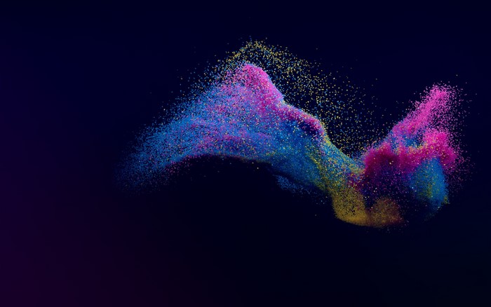Colorful particles swirling in dark background