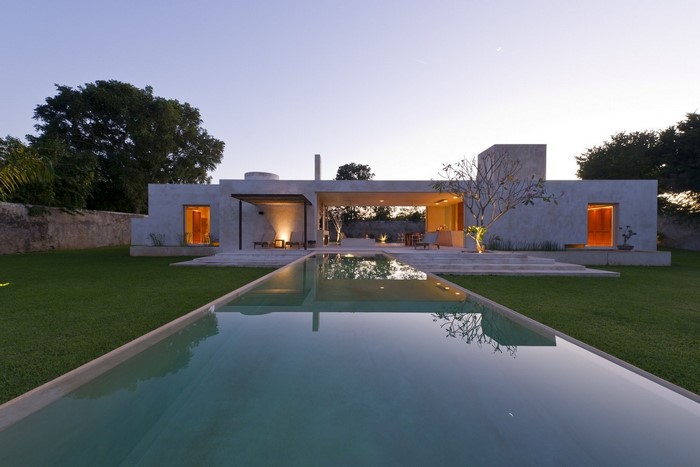 Modern house with swimming pool at dusk
