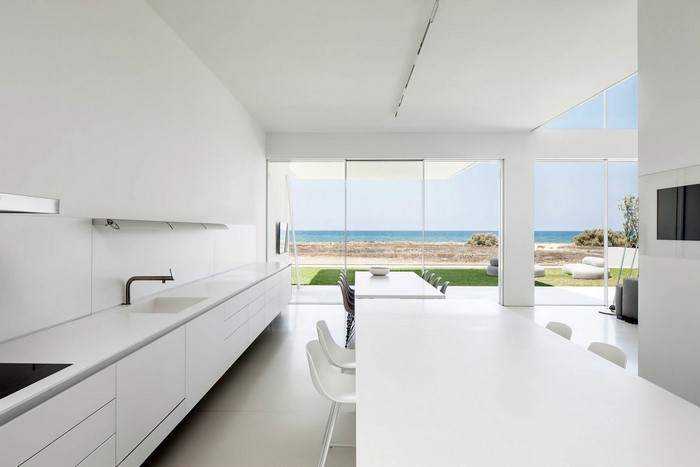 Modern white kitchen with ocean view