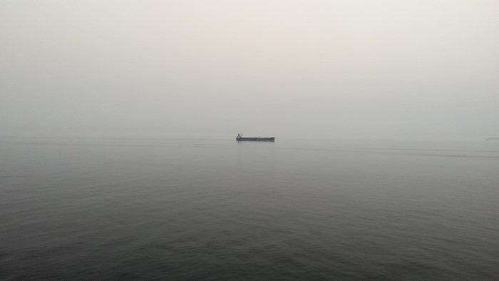 Ship in the mist on the sea