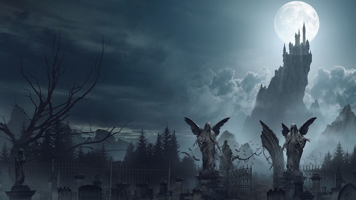 Fantasy graveyard with angel statues and castle under the moon