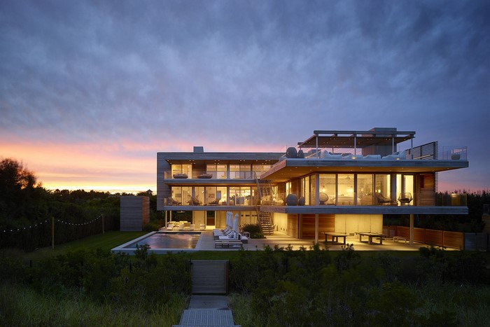 Modern architecture mansion with swimming pool at dusk