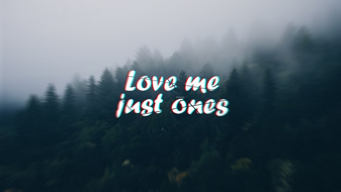 Love me just ones text over foggy forest