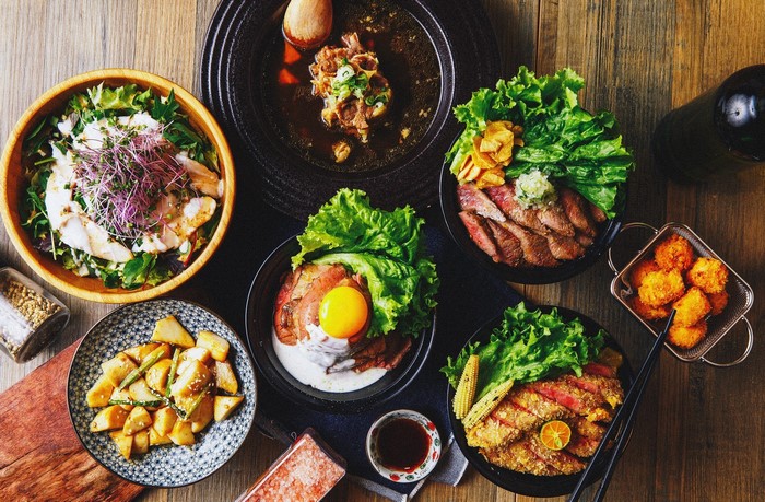 Assortment of Japanese dishes including beef bowls and fried food