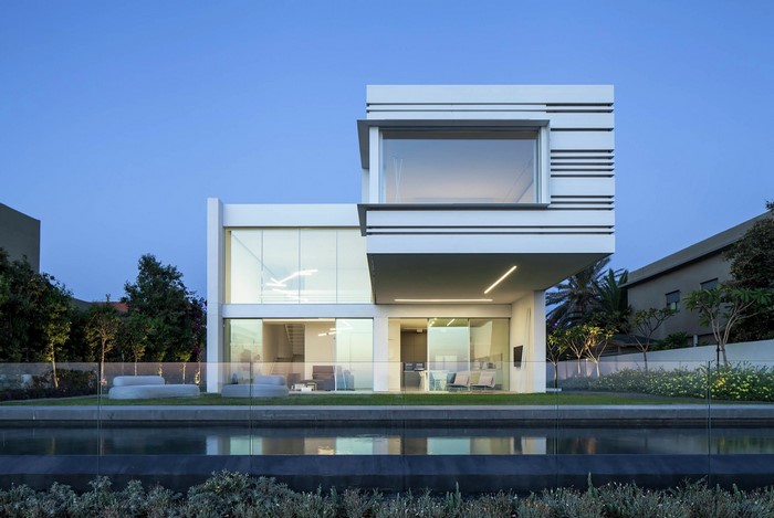 Modern house with swimming pool and glass fence