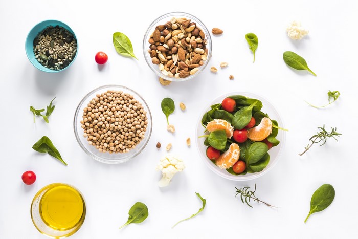 Salad ingredients with olive oil and nuts