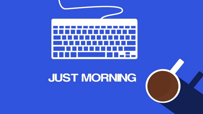 Keyboard and coffee cup with text "JUST MORNING"