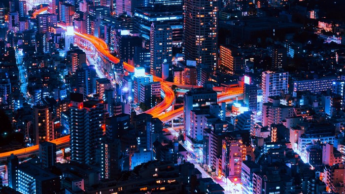 Tokyo cityscape at night with illuminated highways