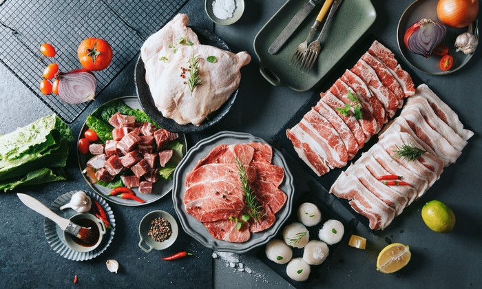 Raw meat and chicken with vegetables and spices