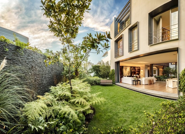 Modern luxury house with a lush garden