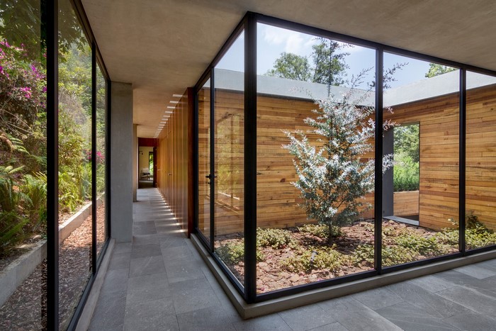 Modern house interior with courtyard and garden view