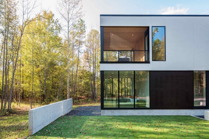 Modern house with large windows and trees