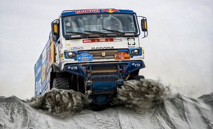 Kamaz truck racing through dirt at Dakar Rally