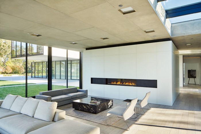 Modern living room with fireplace and large windows