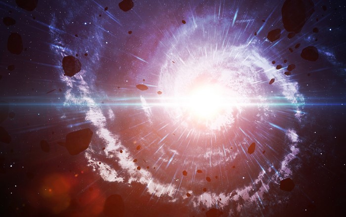 The Big Bang and swirling galaxy with asteroids