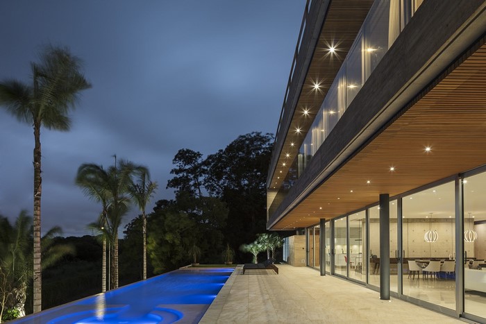 Modern house with swimming pool at dusk