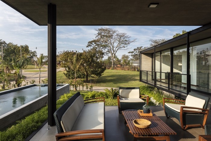 Modern house with swimming pool and patio furniture