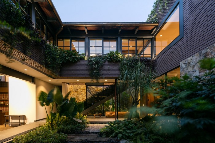 Modern house with plants and stone walls