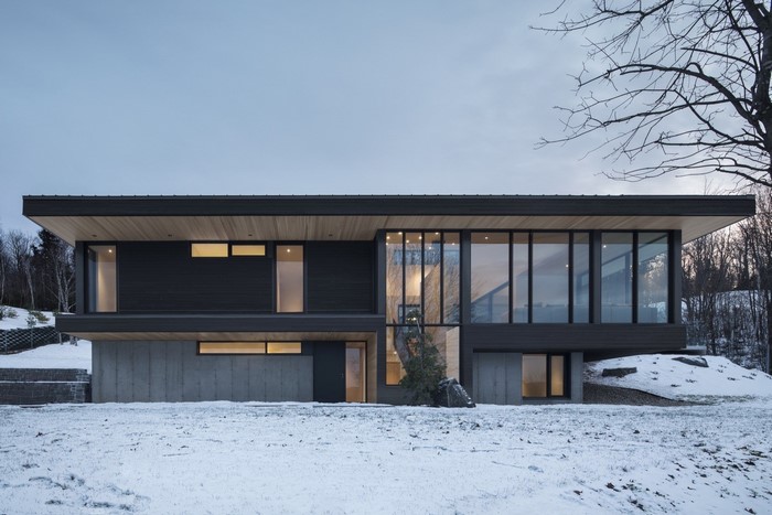 Modern house with large windows in winter