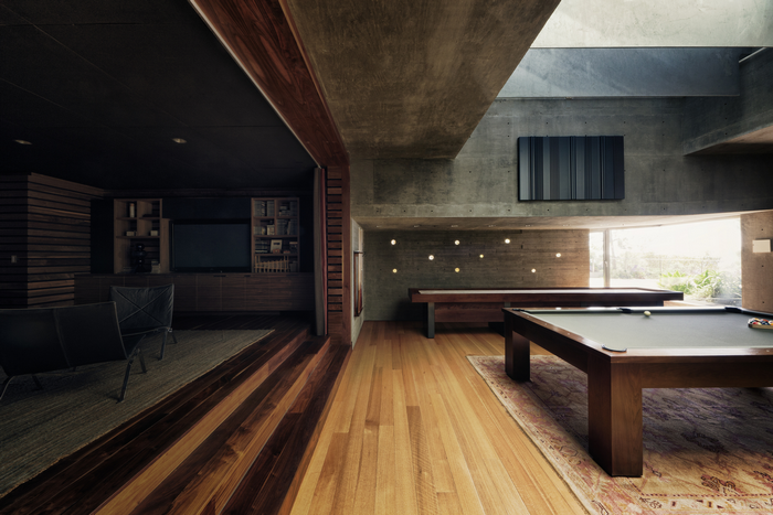 Modern interior with pool tables and lounge area